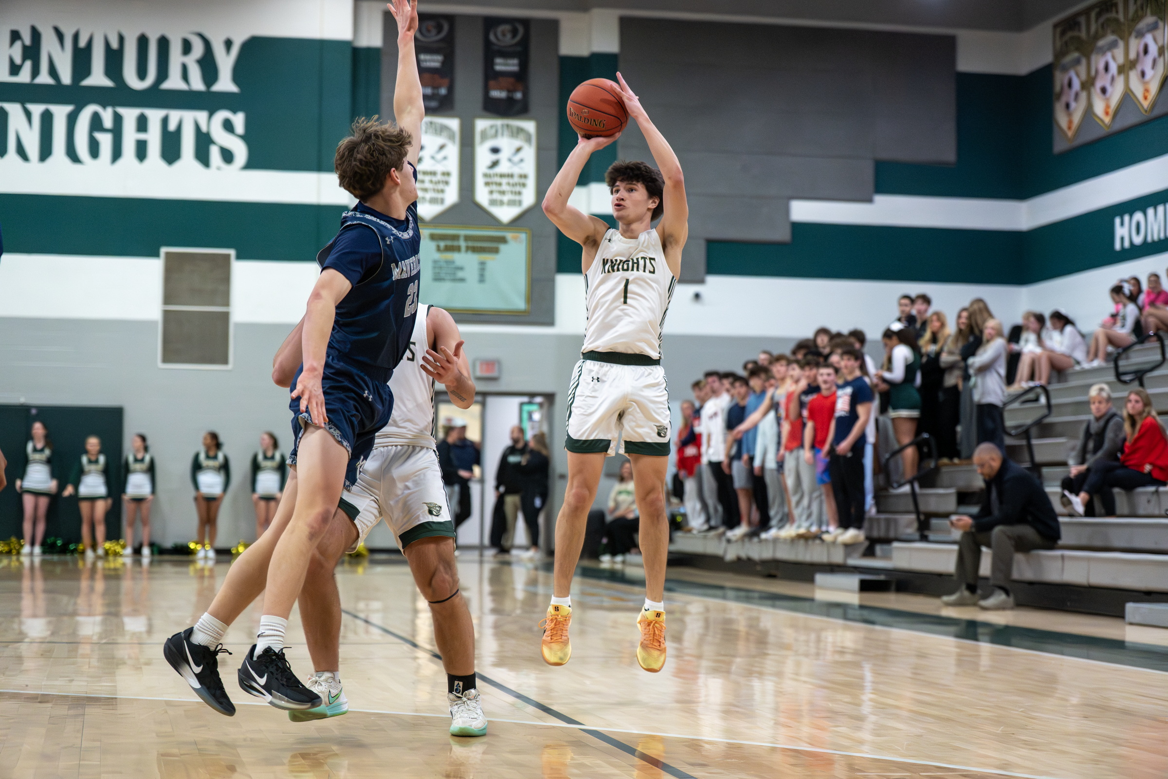 Nate Brown shoots for three during a basketball game at...