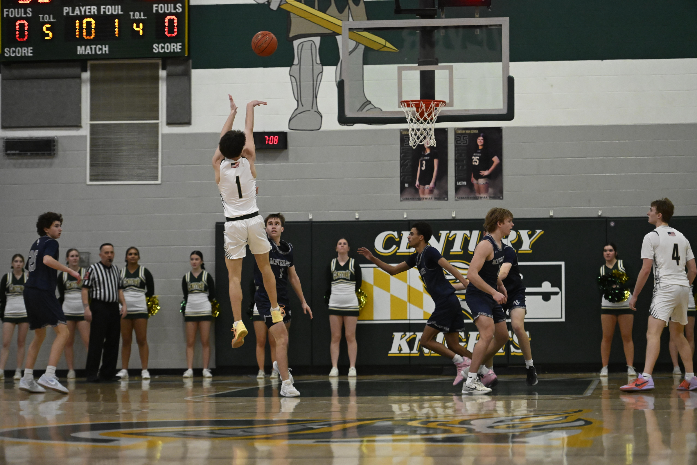 Nate Brown shoots a three-pointer during a basketball game at...