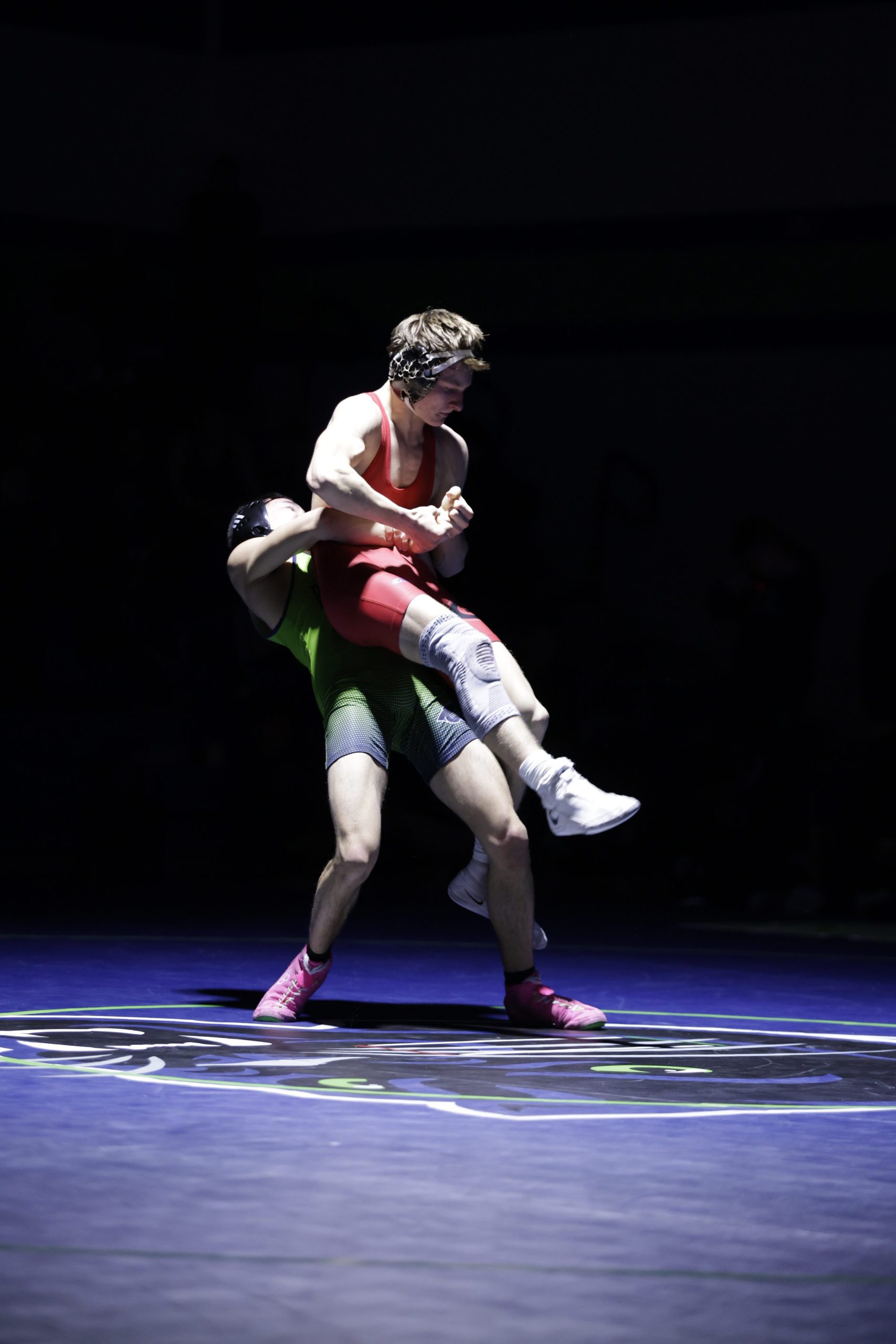 Guilford Parkâs Ethan Brancazio lifts Quinn Hartner off the ground...