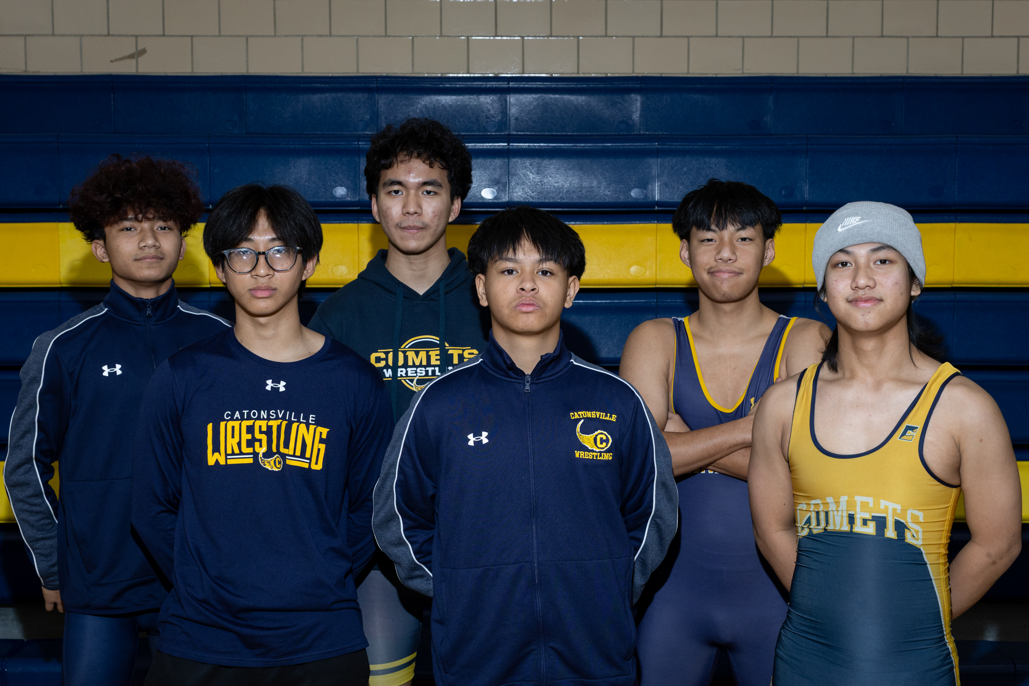 Catonsville wrestlers Joseph Khai, left to right, Semeon Hmo, Pau...