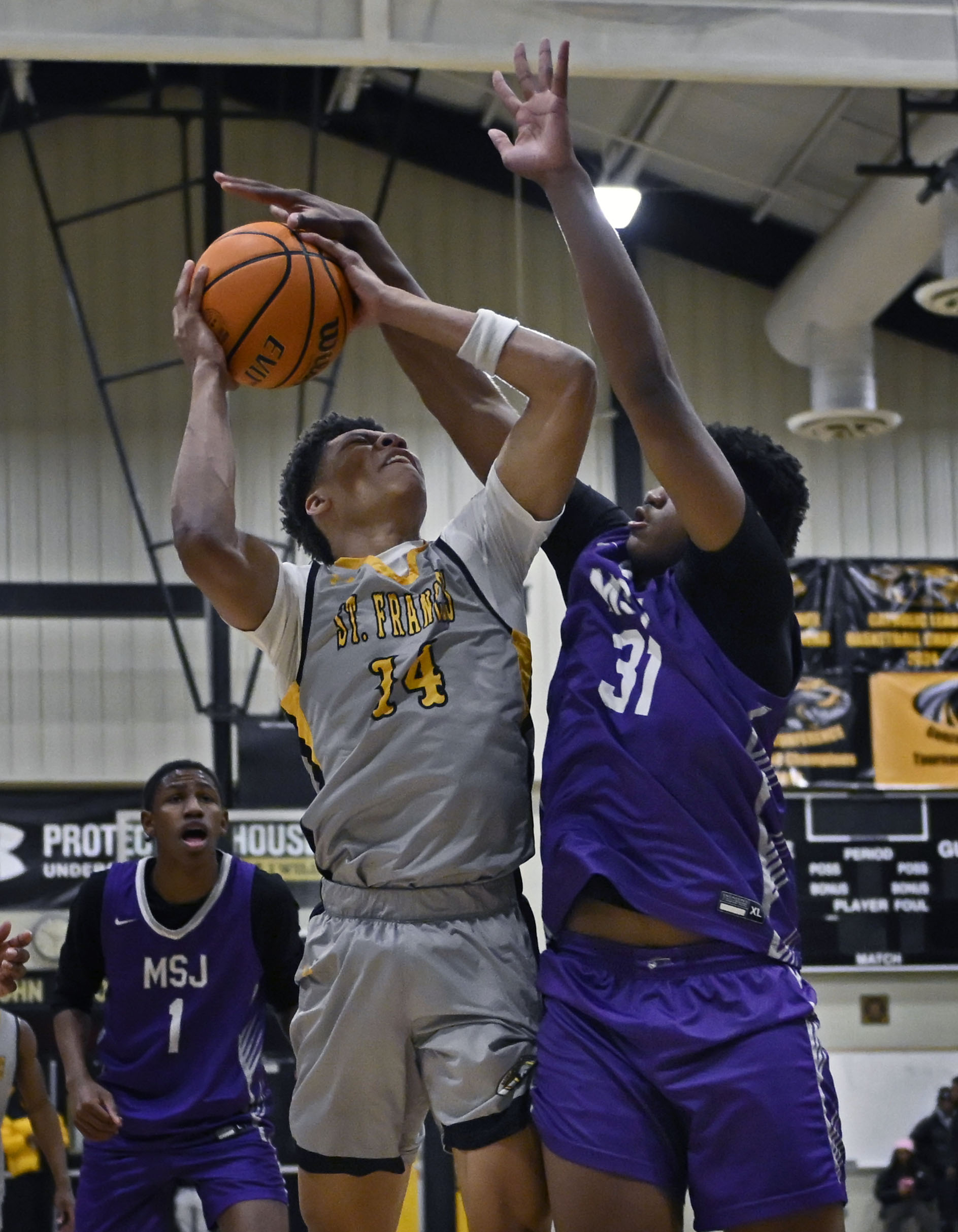 St. Francesâ Jaliel Spears, left, shoots against Mount Saint Josephâs...