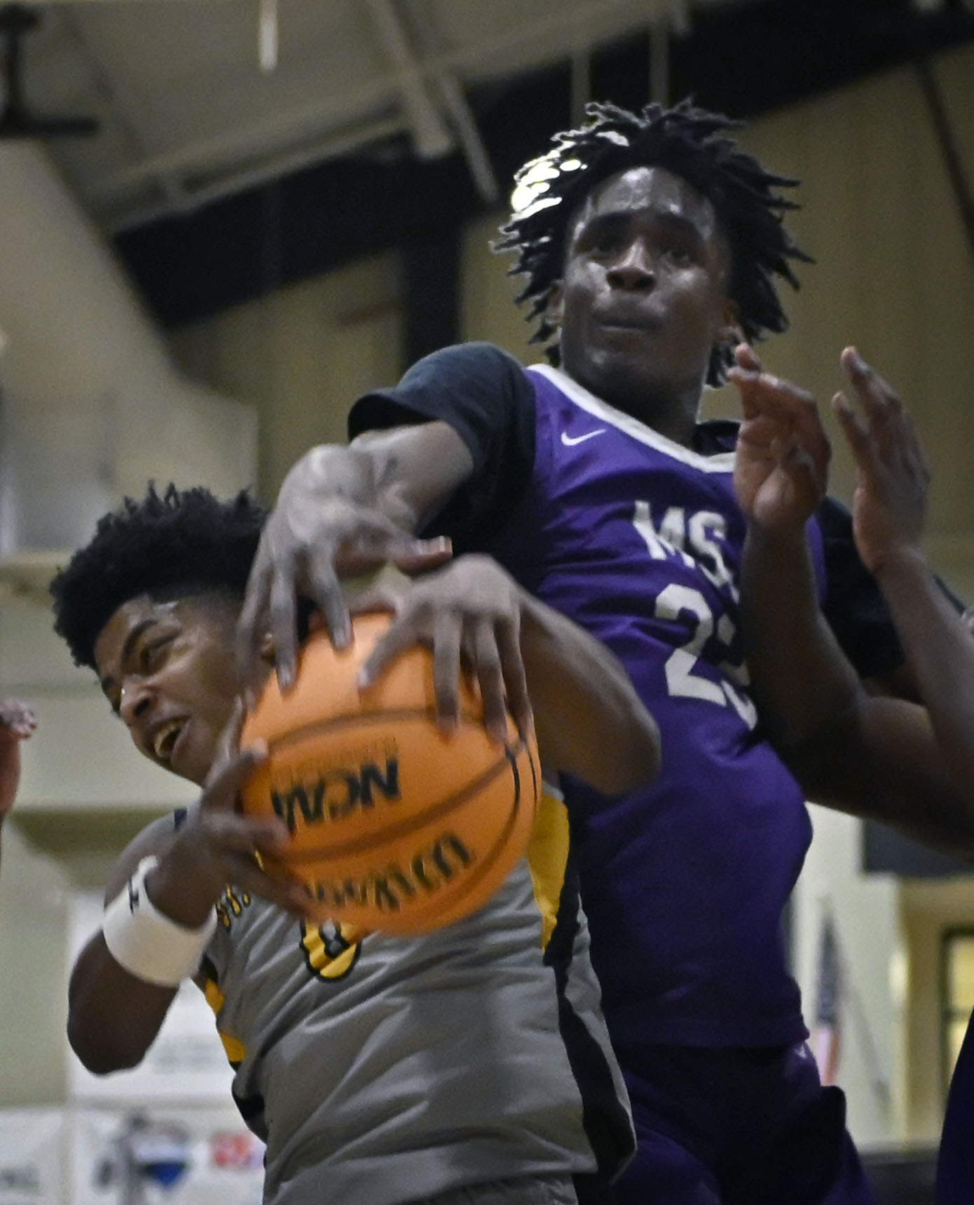 St. Francesâ Terence Jones III, left, grabs a rebound against...