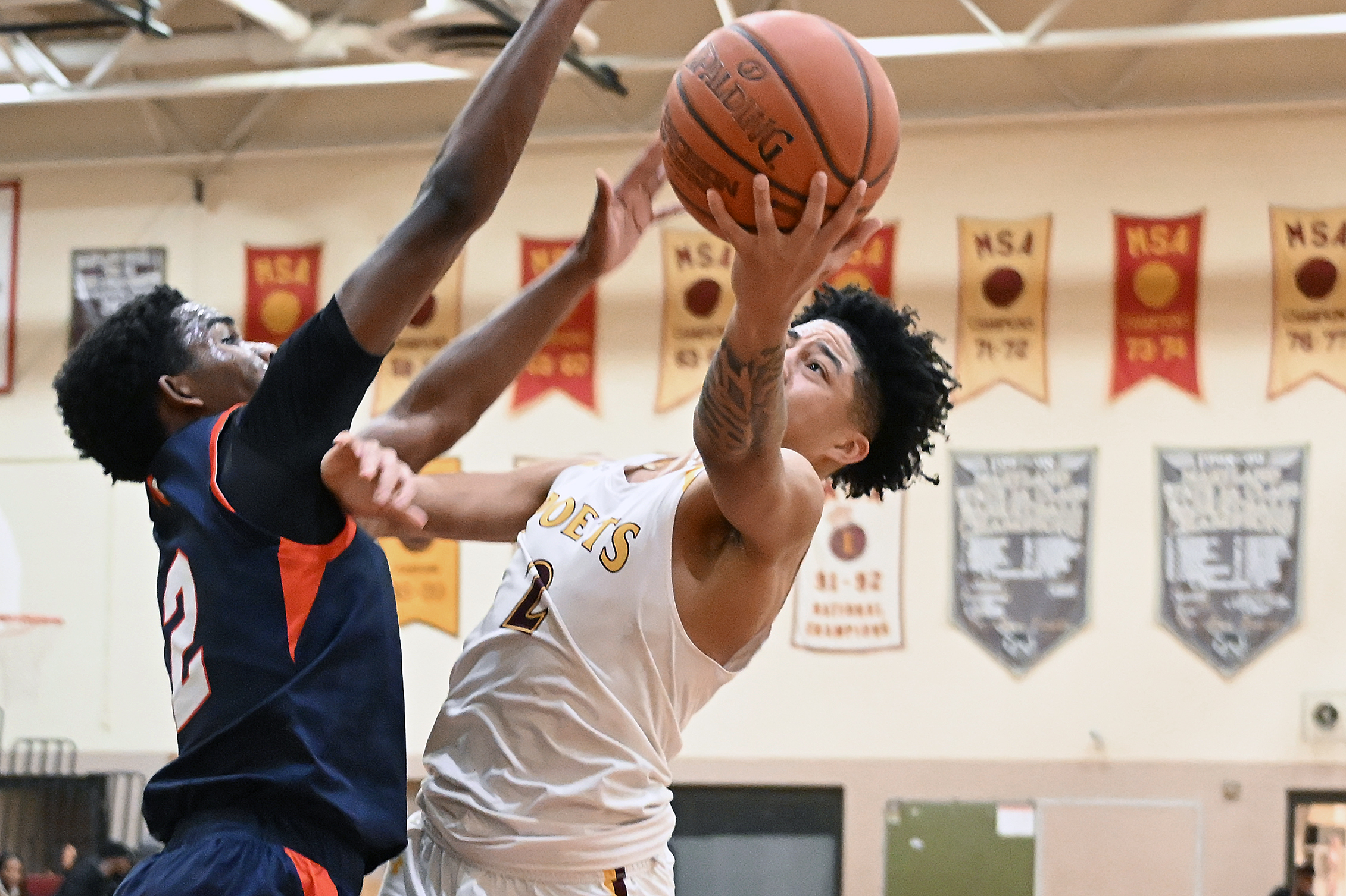 From left, Polyâs Isaiah Bell, does enough to prevent Dunbarâs...