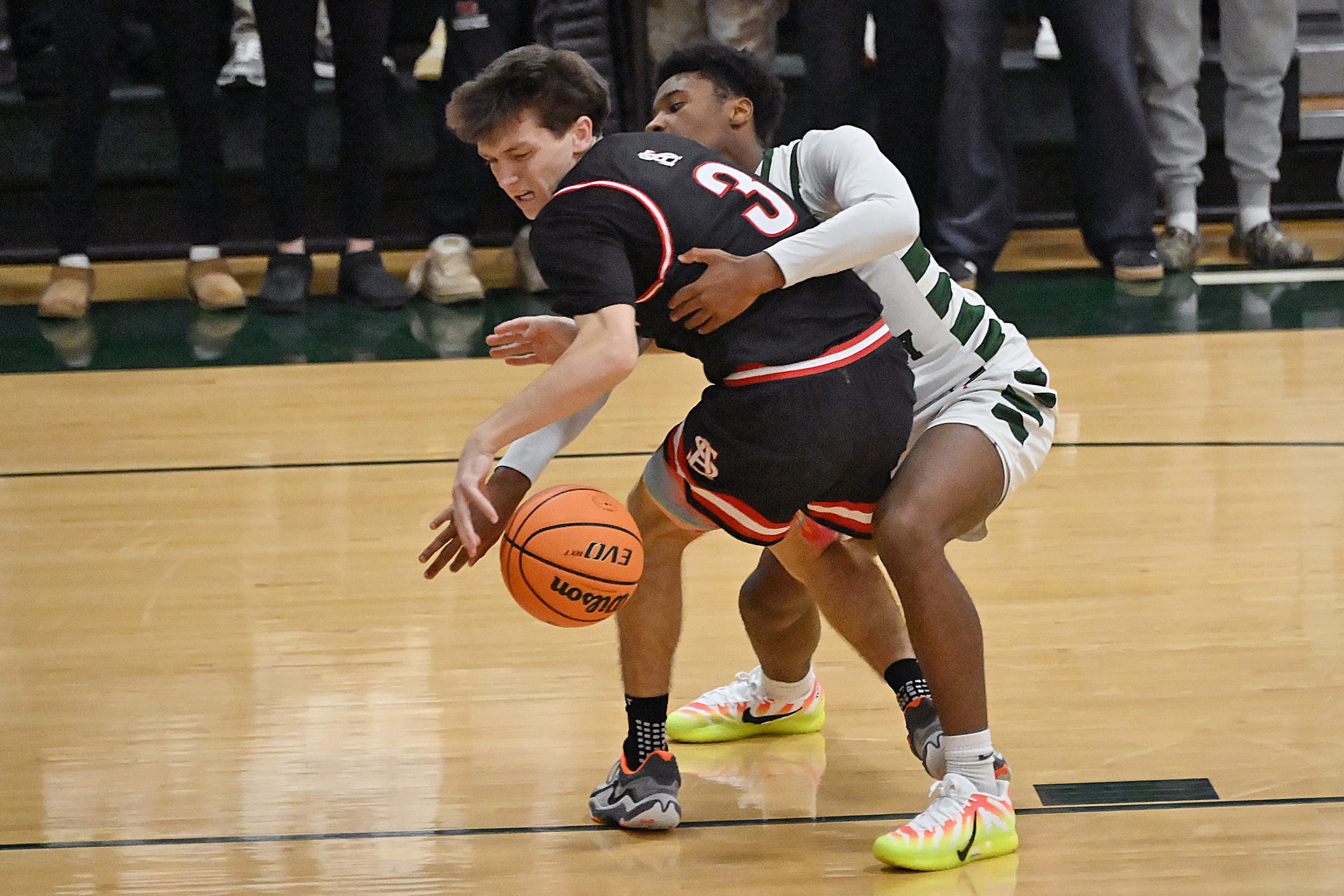 Spaldingâs Robert Lonergan keeps control of the ball under pressure...