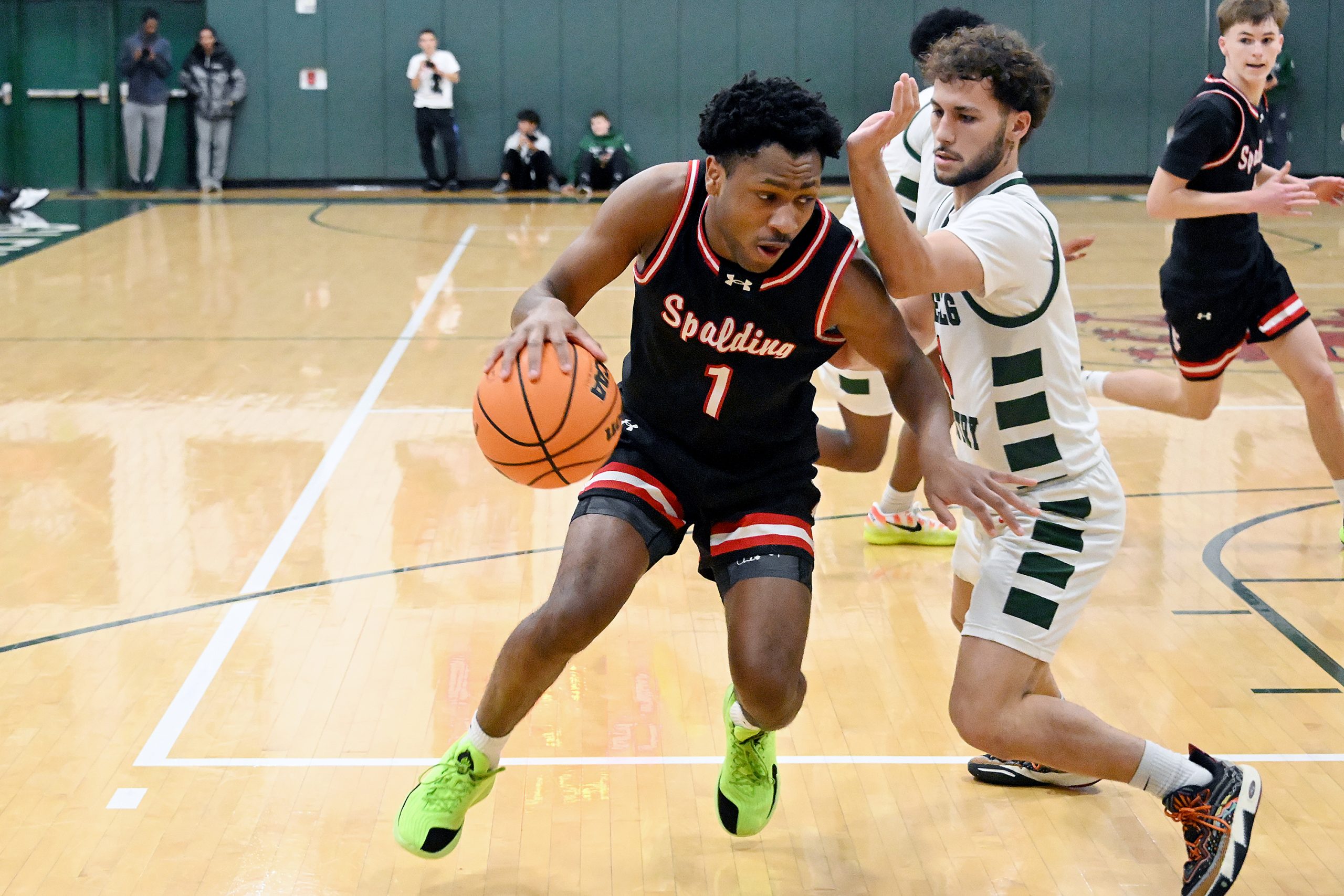 Spaldingâs Terrence Moultrie looks for space as Glenelgâs Henrique Tavares...