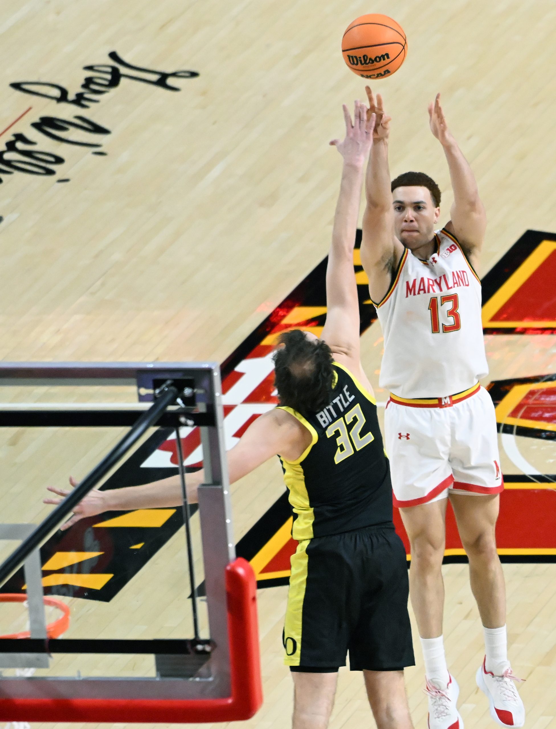 Marylandâs Elijah Saunders takes a shot as Oregonâs Nate Bittle...
