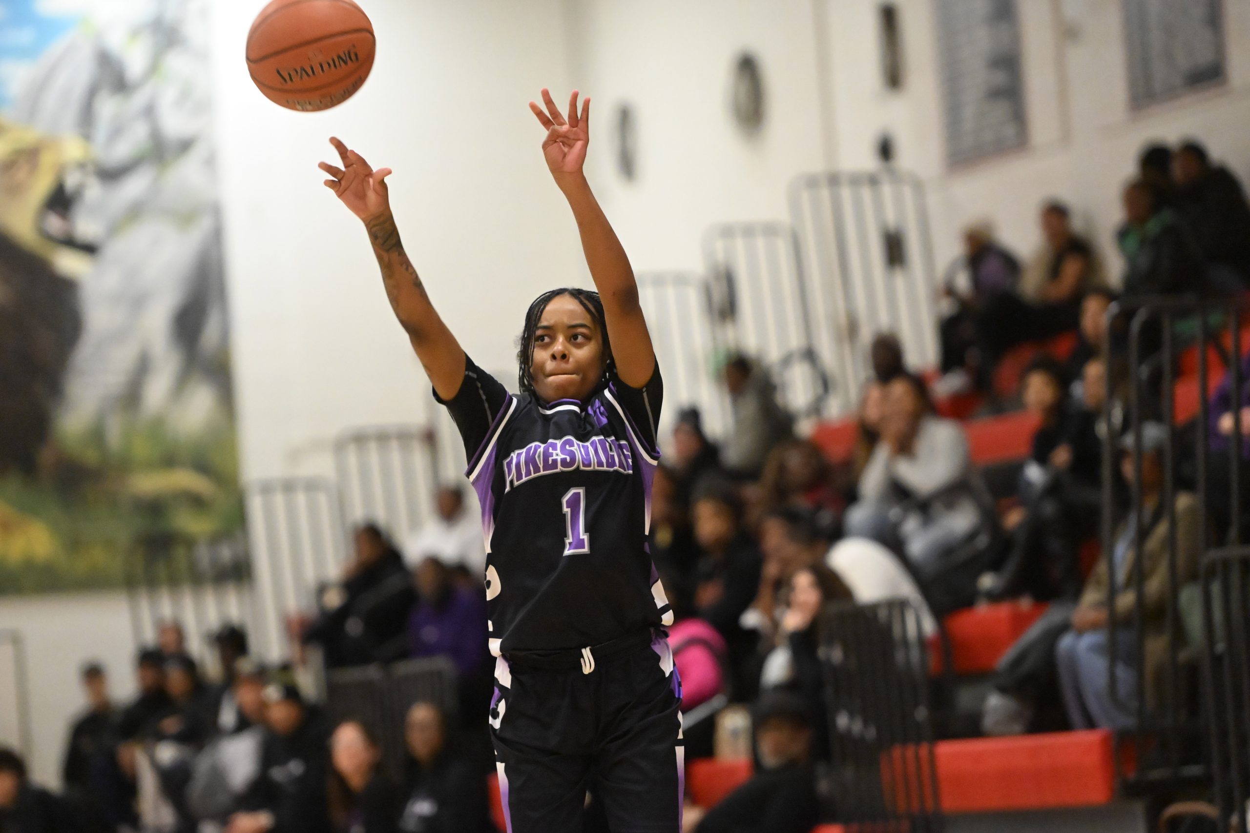 Pikesville's Mariah Jones-Bey releases a shot from 3-point range during...