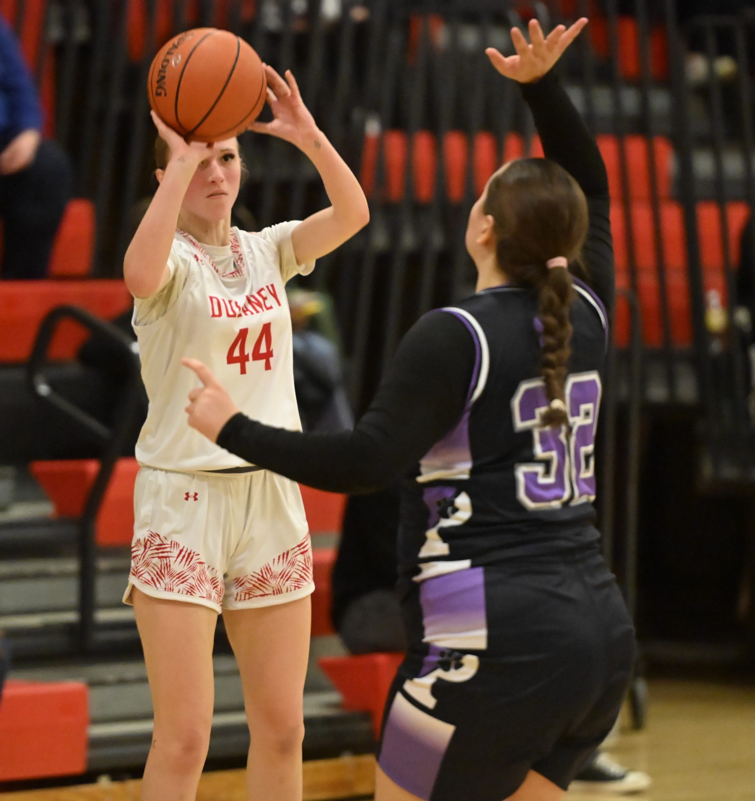Dulaney's Brenley Graham takes aim at a 3-point shot with...