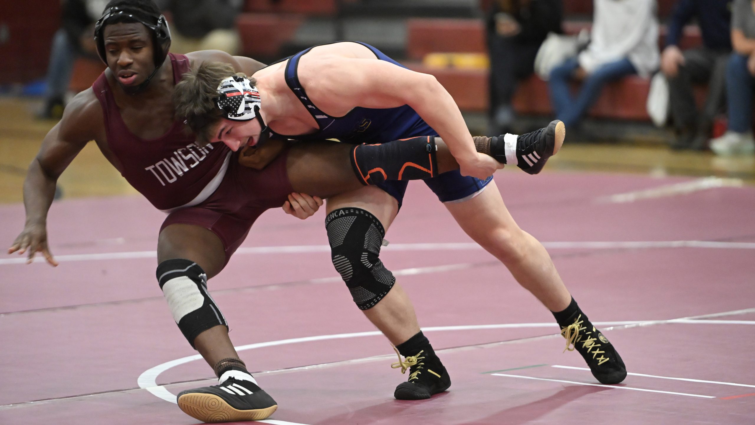 Perry Hall's Clayton Hosier tries to take down Towson's Mustapha...
