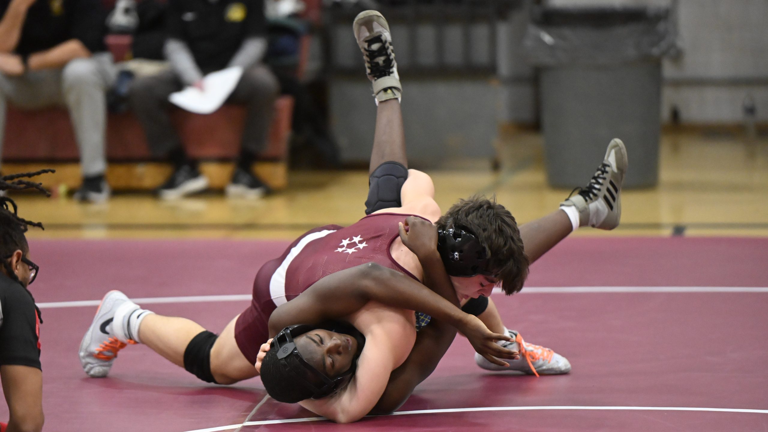 Towson's Ethan Grace prepares to pin Perry Hall's Ritche Briggs...