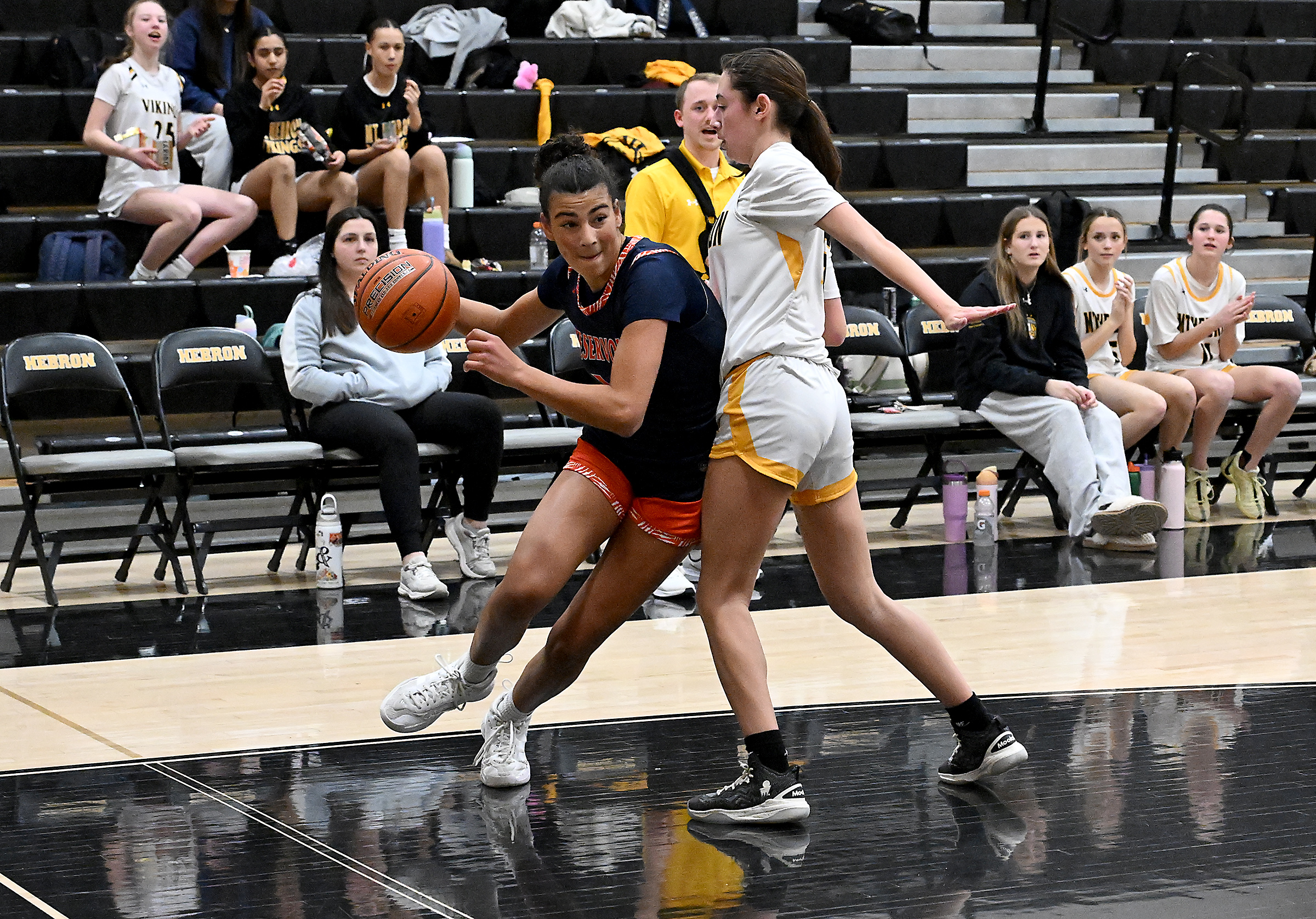 Reservoir's Sam Feher drives down the baseline in the first...