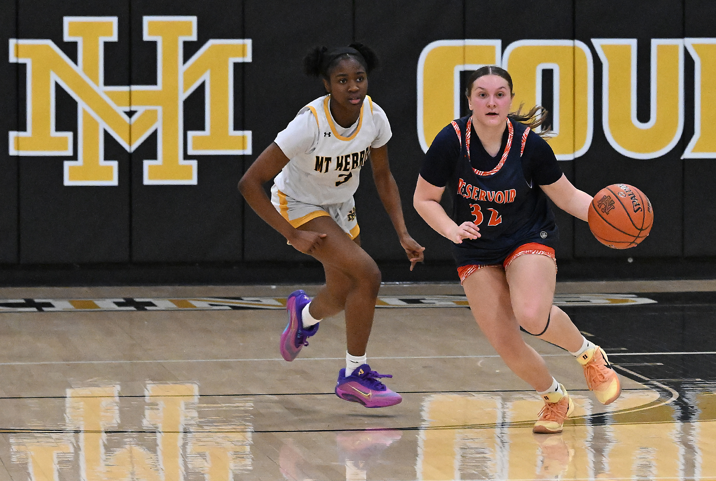 Reservoir #32, Leah Lauer brings the ball upcoart in the...